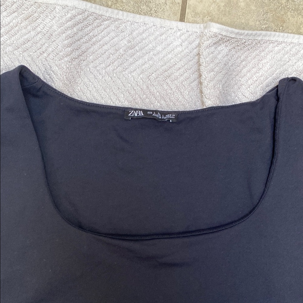 Black Sleeveless Drape Top square contour